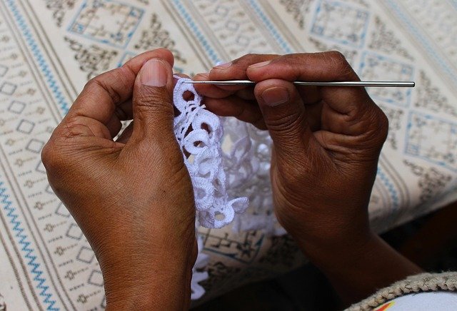 Close-up of intricate Kashmiri sozni needle embroidery on fabric
