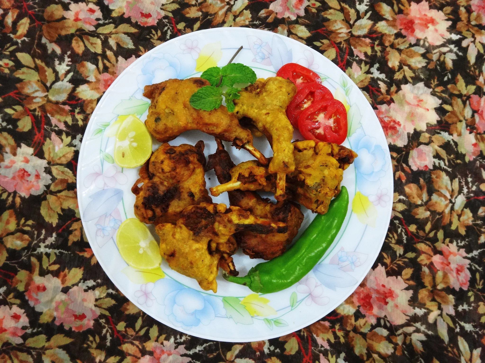 Plate of kabargah, fried lamb ribs from the Kashmiri wazwan