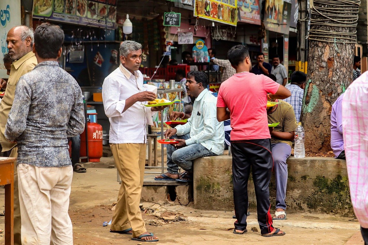 A Srinagar street food stall with fresh kulchas and steaming samovars