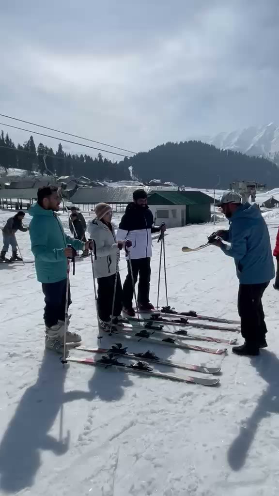Ski instructor briefing a beginner group at Gulmarg